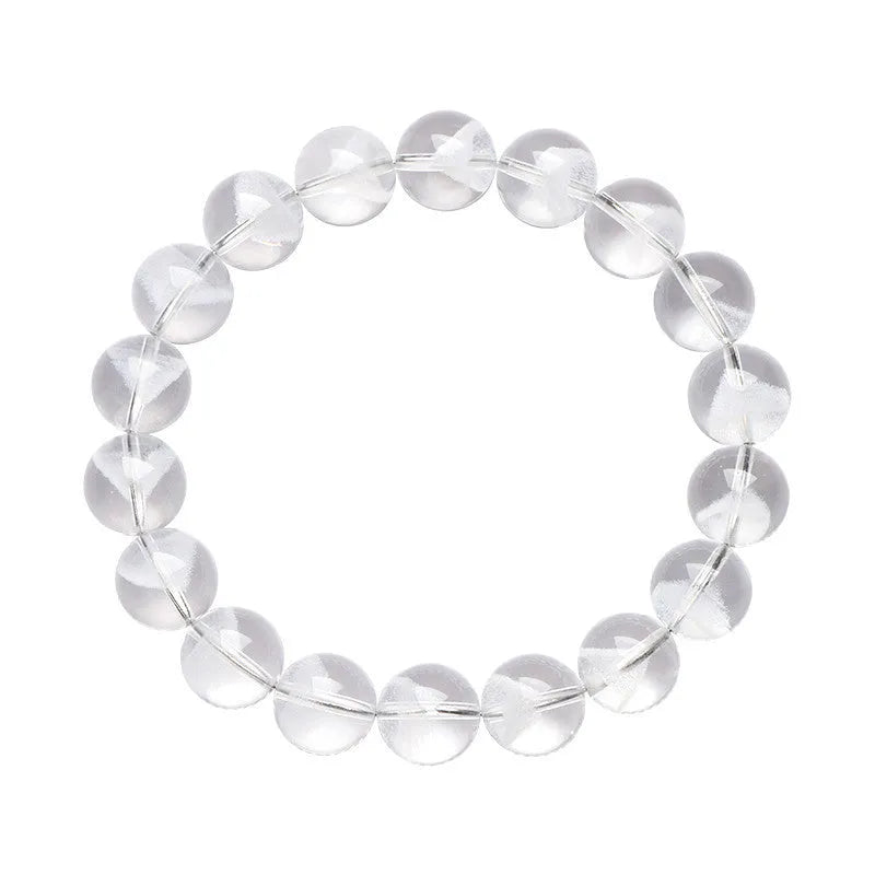 Women's white crystal bracelet with a ghost pyramid charm and Ruyi symbol, showing round beads.
