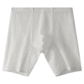 Men's lengthened transparent lace boxer shorts on a neutral background, showing mid waist and leg detail.