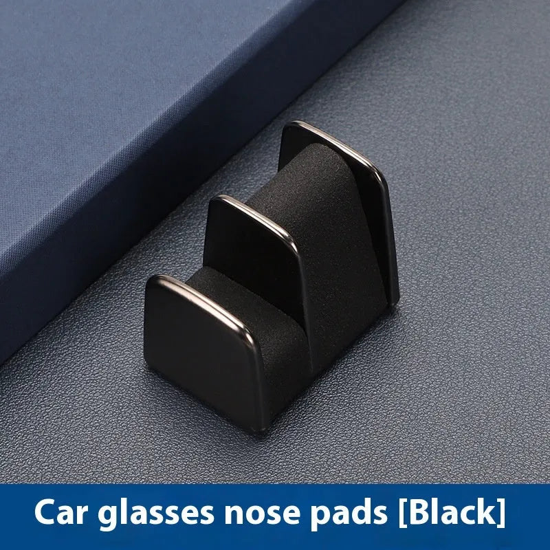 Zinc alloy and leather car dashboard clip for holding glasses in black, grey, green, or red.