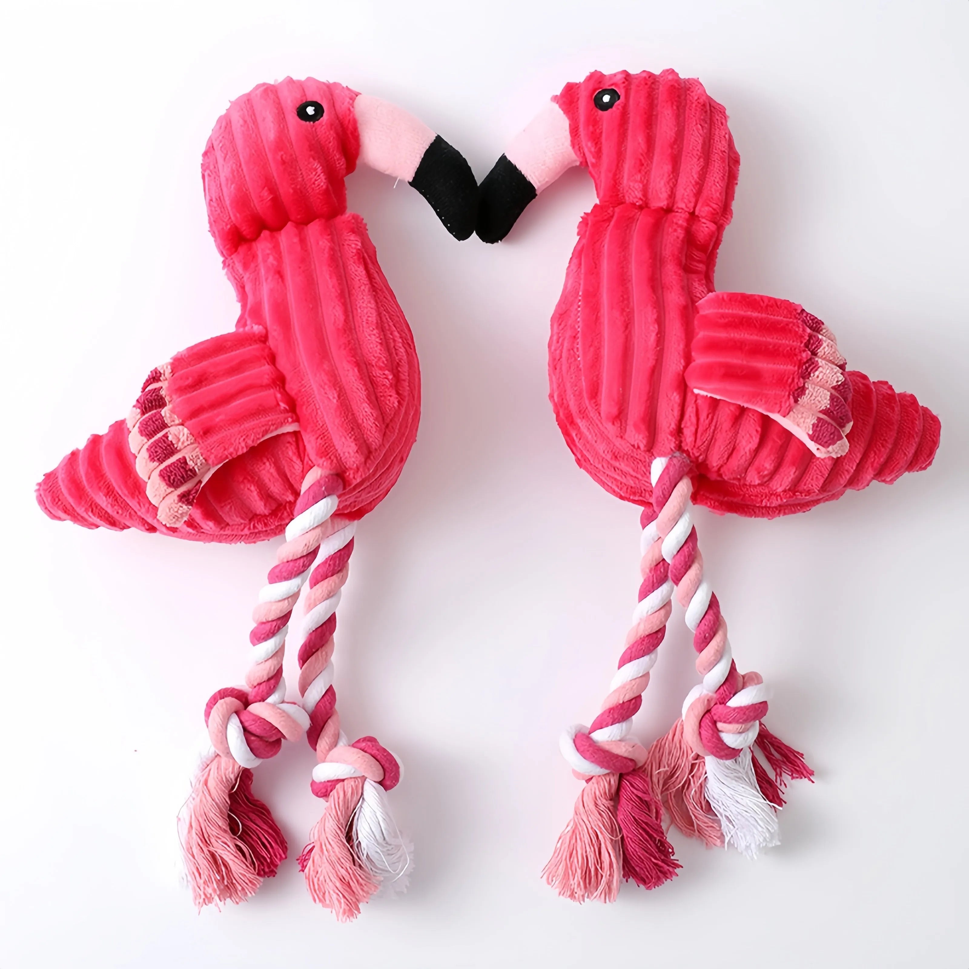 Pink animal-shaped corduroy plush dog toy with a squeaker.