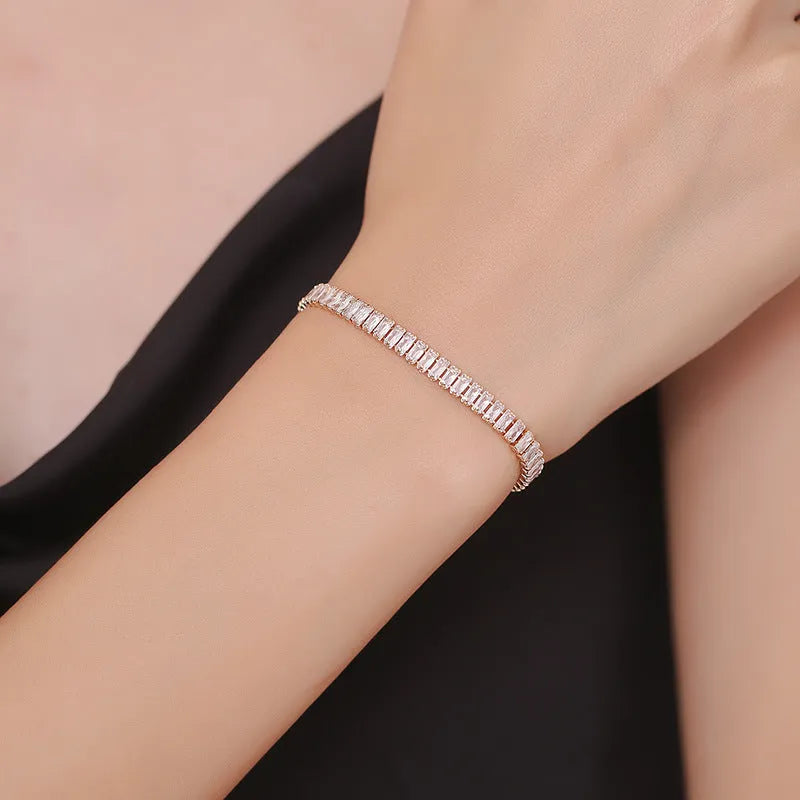 Geometric brass bracelet with quadrilateral full diamond zircon inlay in champagne gold colour