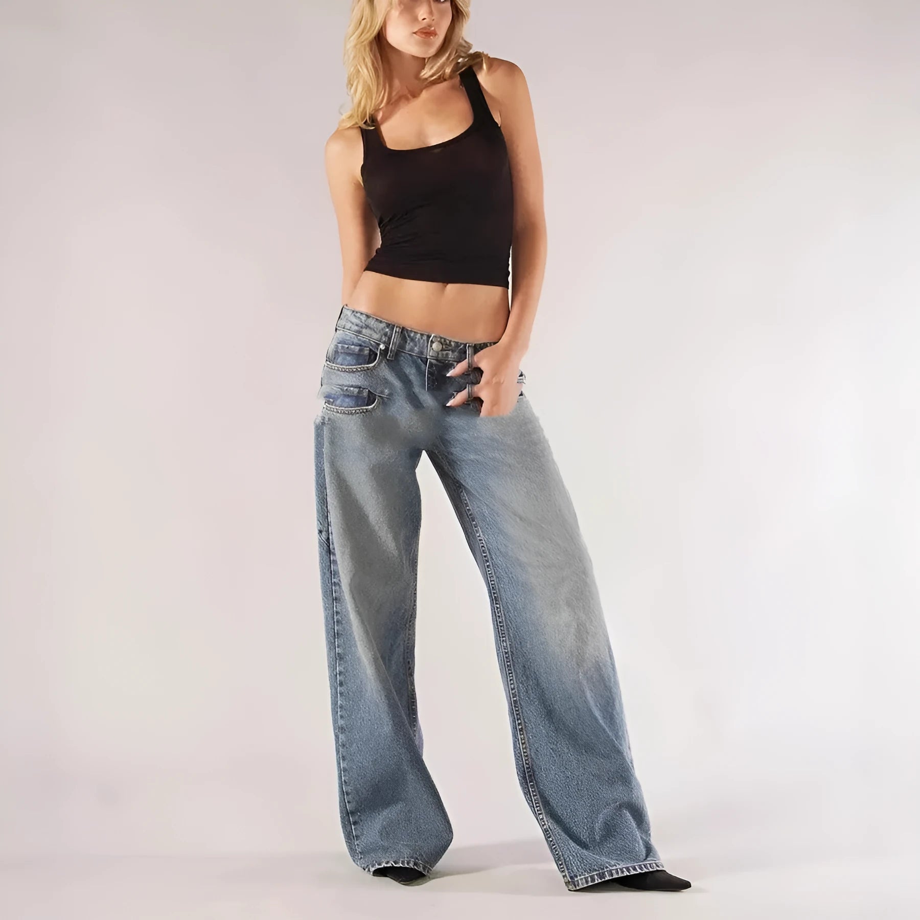 Blue cotton loose straight wide leg women's trousers on a hanger, showing low waist and stitching detail.