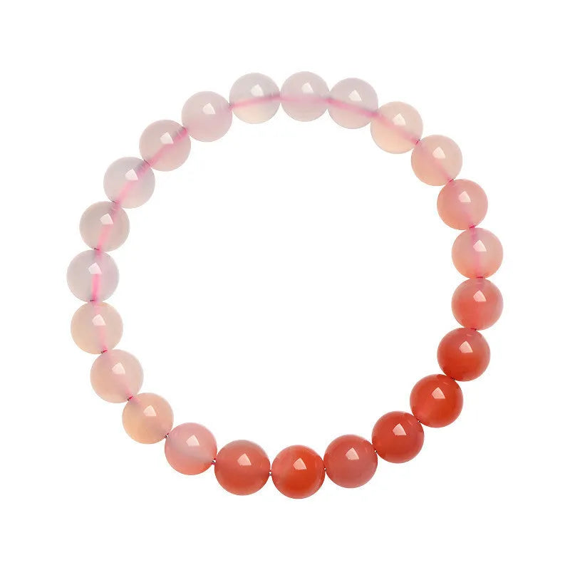Natural gradient Yanyuan agate bracelet with geometry-shaped beads on a wrist.