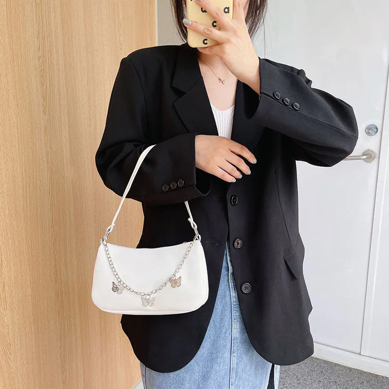 A structured square women's chain underarm bag in PU leather, shown in black, white, khaki, and light blue colour options.