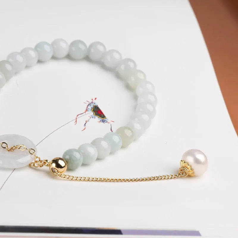 Natural jade bracelet with peace buckle fastener and white pearl accents, geometric pendant design