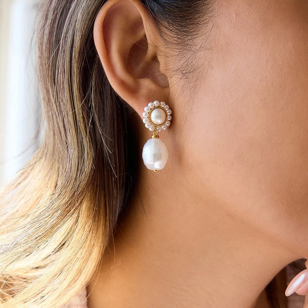 Women's stainless steel light pearl ear studs, geometric shape, electroplated finish, one pair.