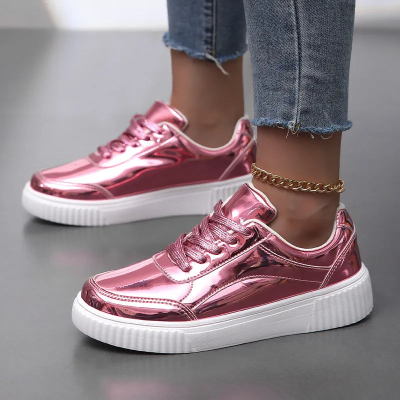 Gold sequinned platform sneakers with a round toe and a thick MD sole.