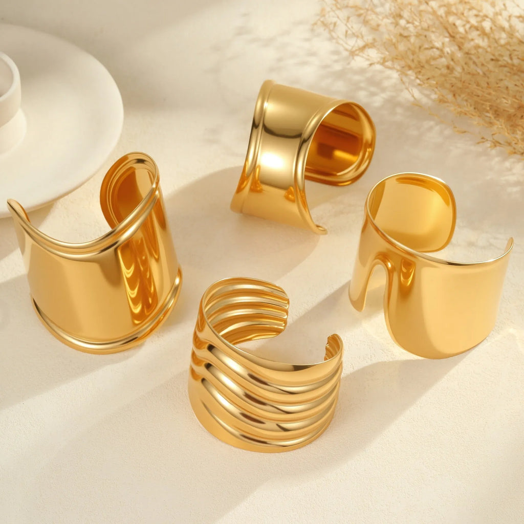 Gold plated wide women's bracelet with geometric wave design and niche opening