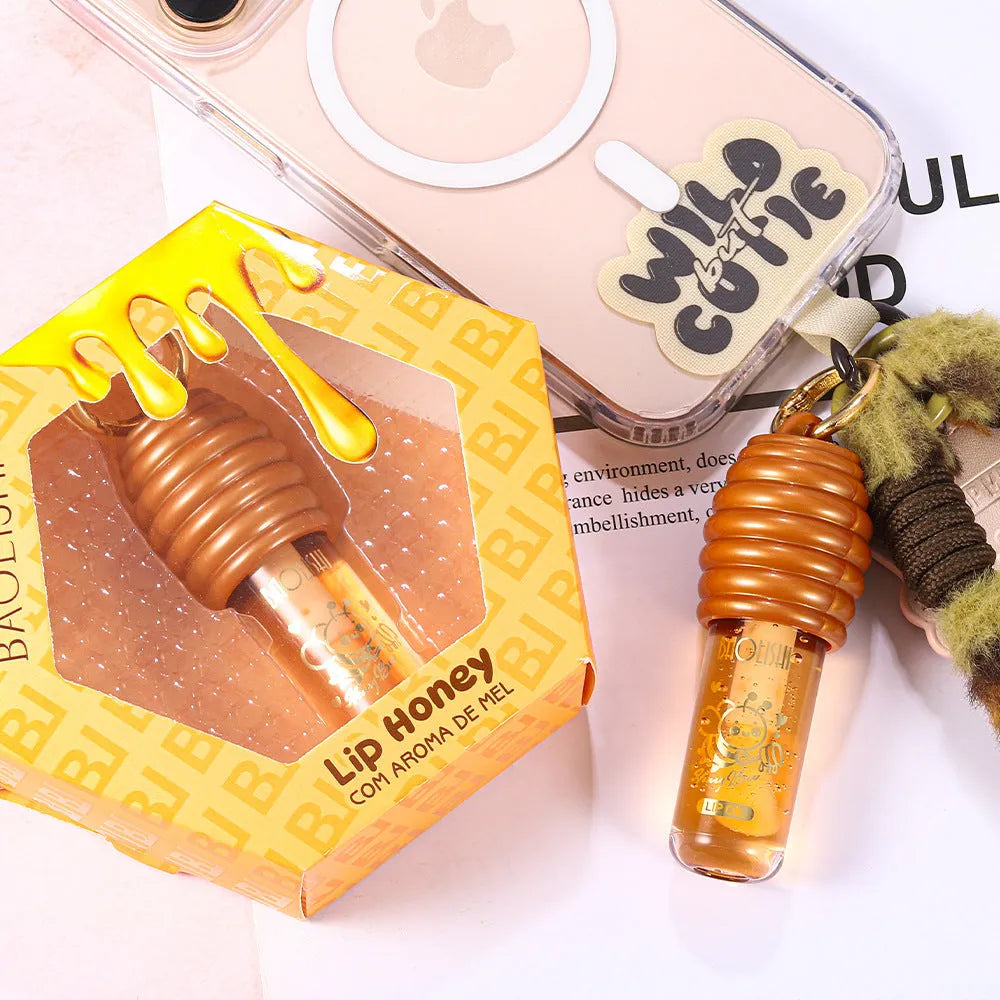 Portable honey lip gloss in keychain pannier bag with moisturising properties