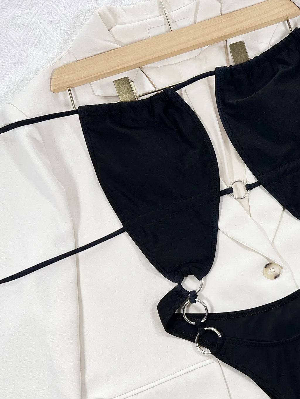 Steel Ring black solid colour one-piece swimsuit for women on a mannequin.