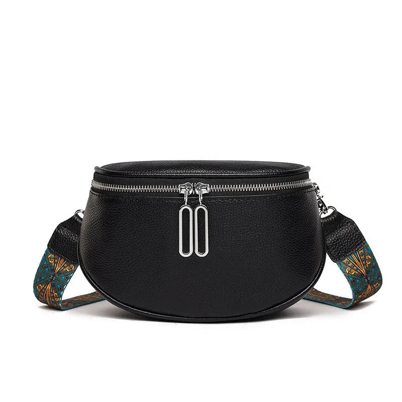 Women's soft PU messenger bag in saddle shape with single shoulder strap and zippered interior compartment
