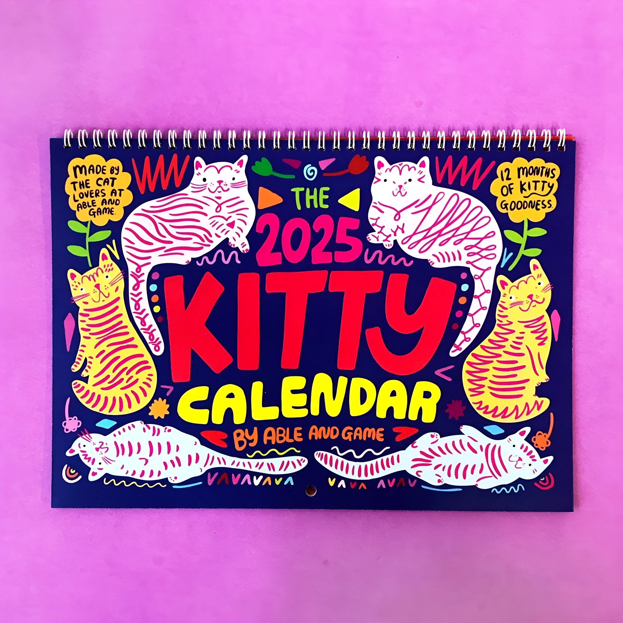 A3 Cat Calendar Wall Planner showing colourful monthly illustrations with hanging cord.