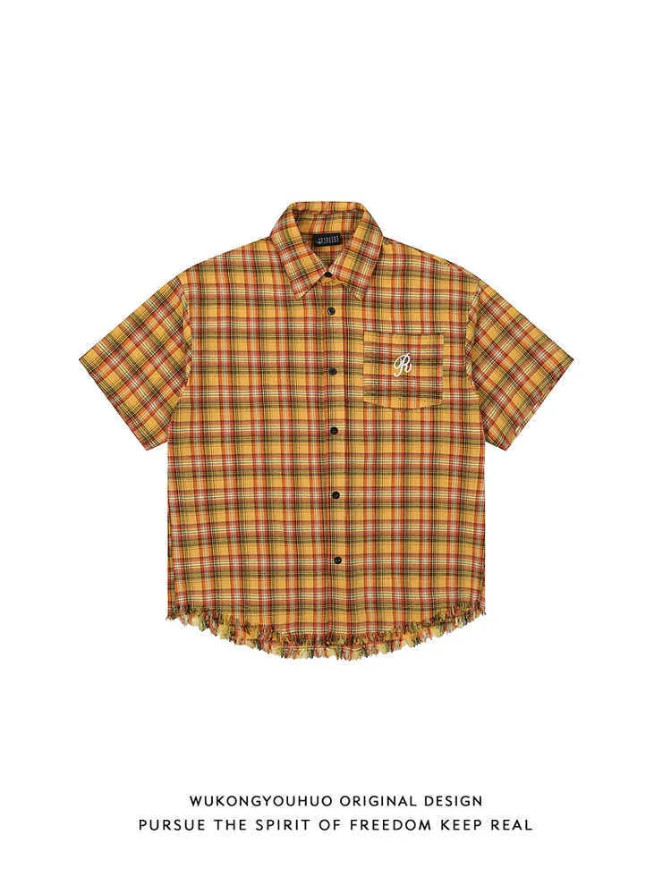 Yellow and white grid pattern short sleeve shirt with loose fit and embroidered chest pocket.