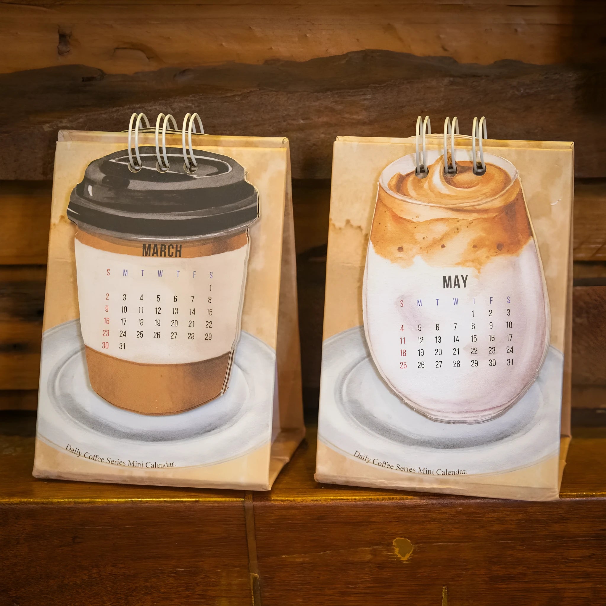 Mini 2025 desk calendar showing four design options including coffee time and motivational phrases