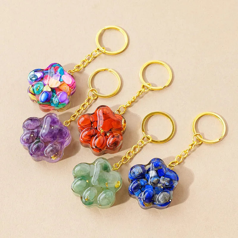 Small natural crystal cat's paw claw charm on a metal loop keychain