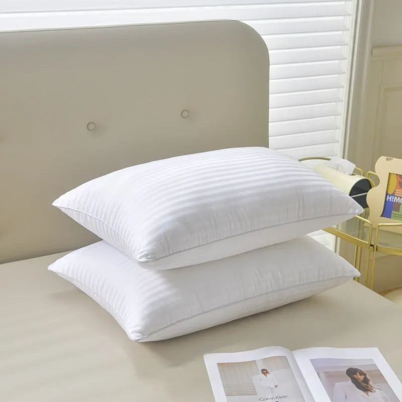 White cotton satin stripe feather pillow showing natural filling and simple styling