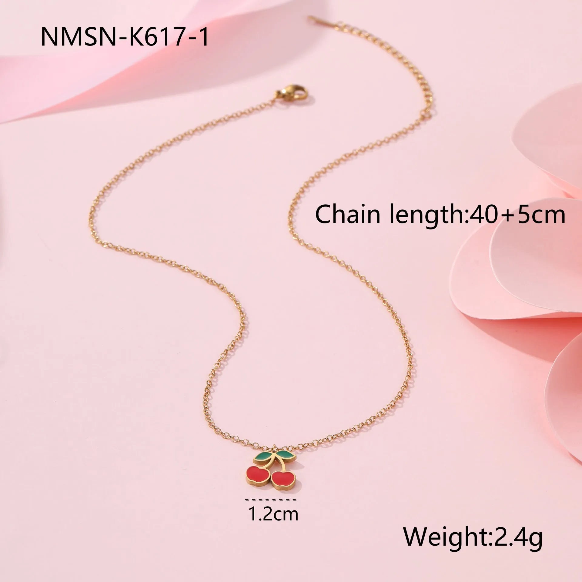 Four-piece stainless steel cherry jewellery set with gold plating: necklace, bracelet, earrings, and ring.