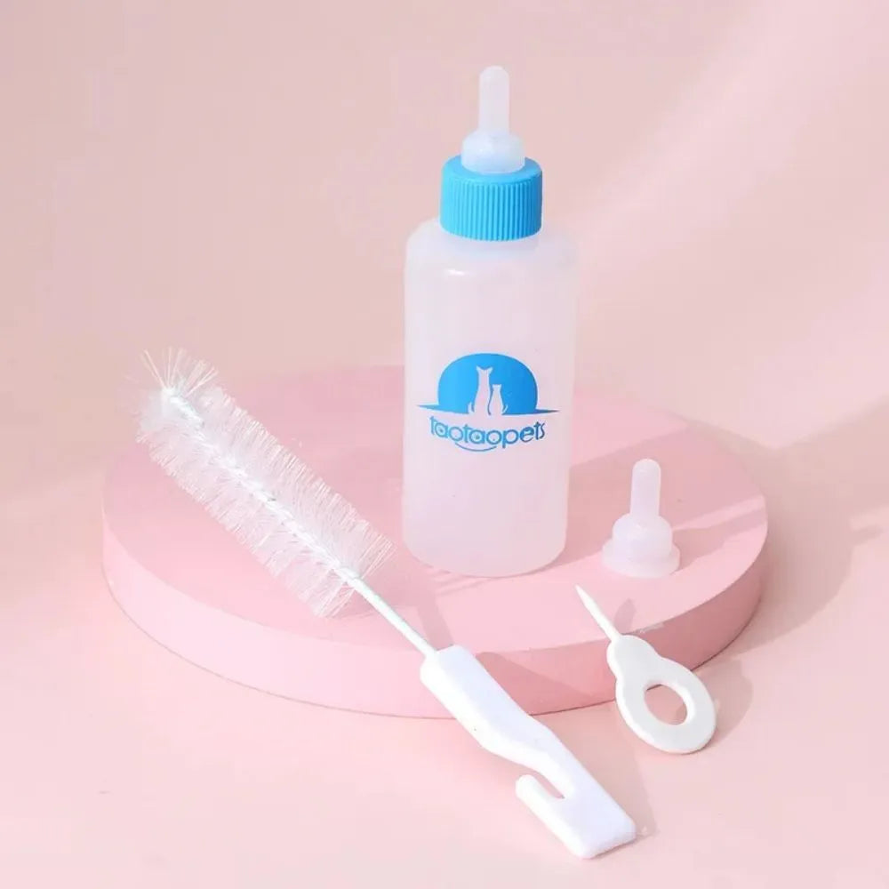 Set of four coloured pet milk bottles with a cleaning brush for feeding newborn puppies and kittens.