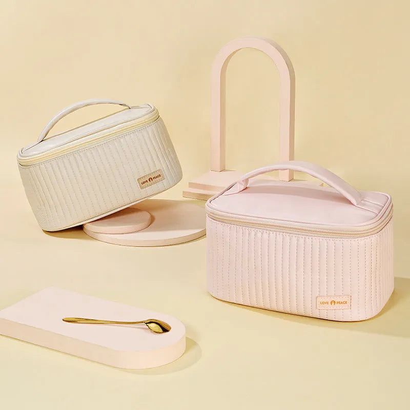 Open-top solid colour PU leather makeup bag in light blue on a white surface