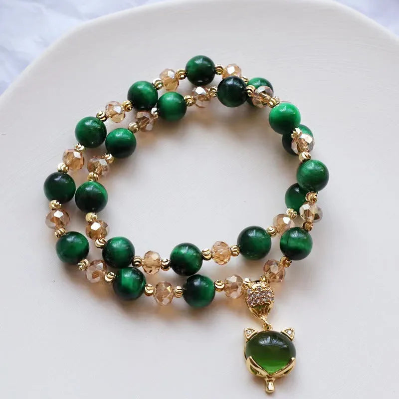 Handmade natural Vanves stone Tigereye bracelet on wrist showing single or double chain with fox motif.