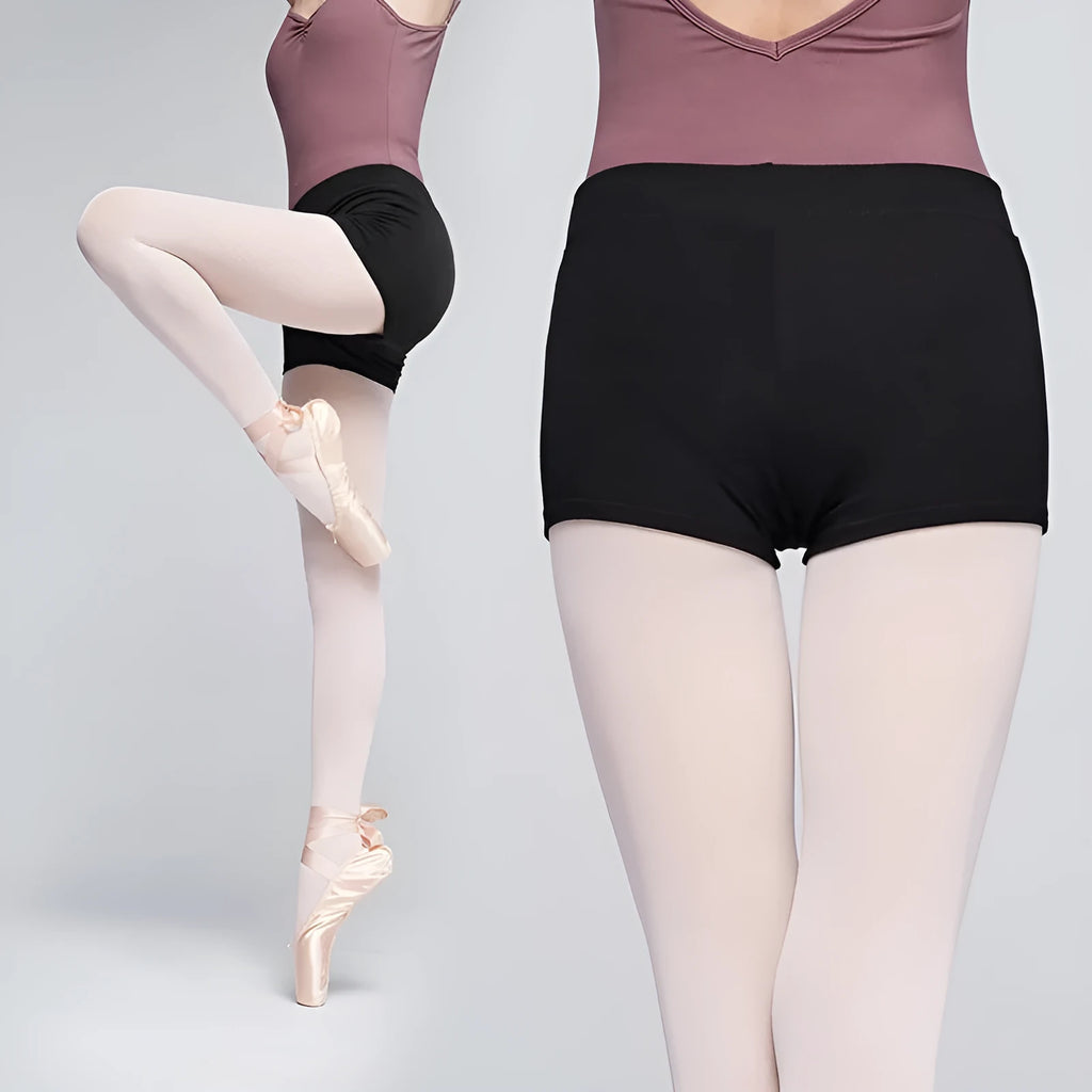 Black cotton dance shorts for women laid flat, showing solid colour and simple design for ballet practice.