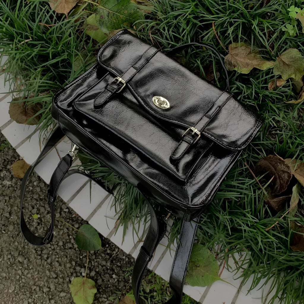 Black college messenger bag with PU construction showing 35cm length dimensions