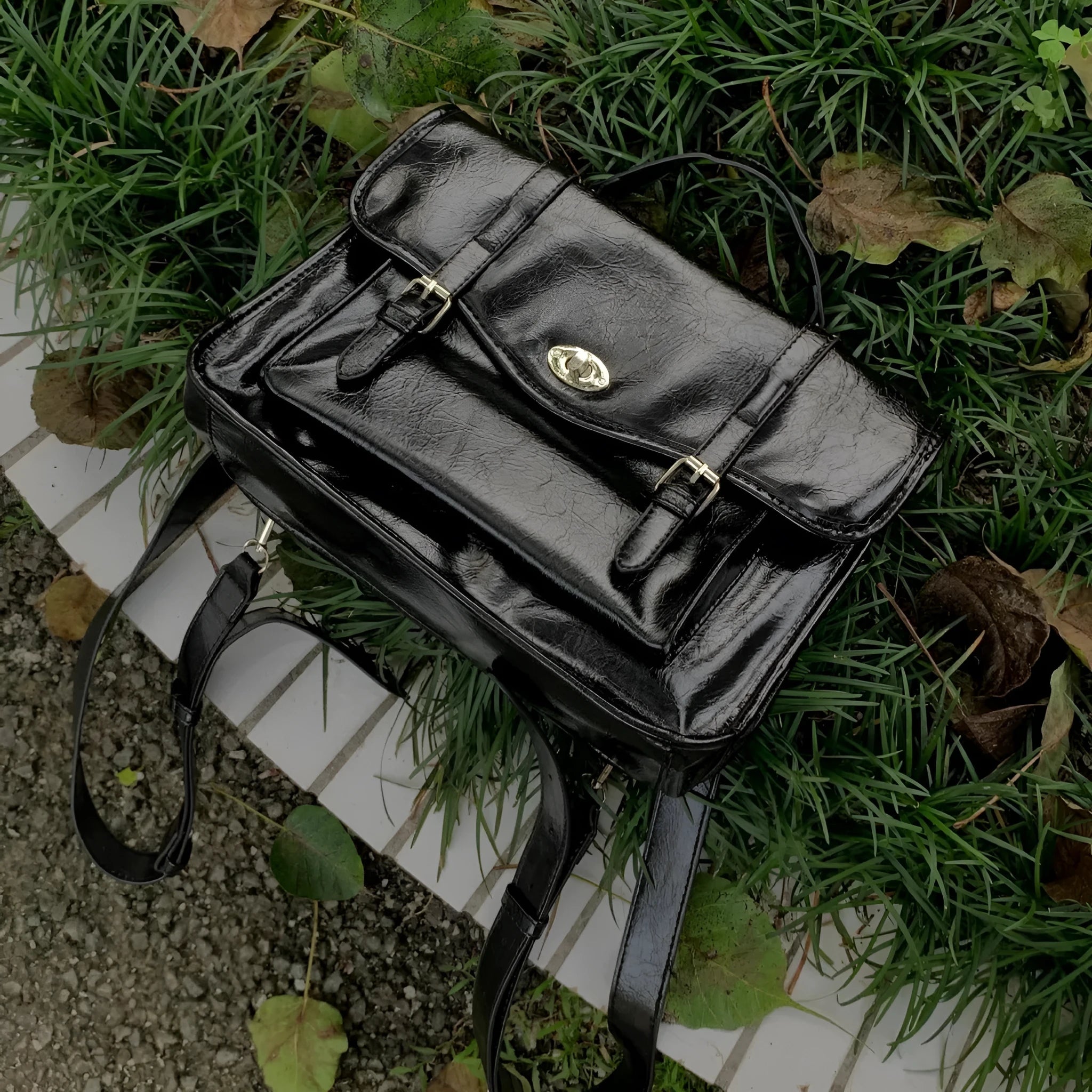 Black college messenger bag with PU construction showing 35cm length dimensions