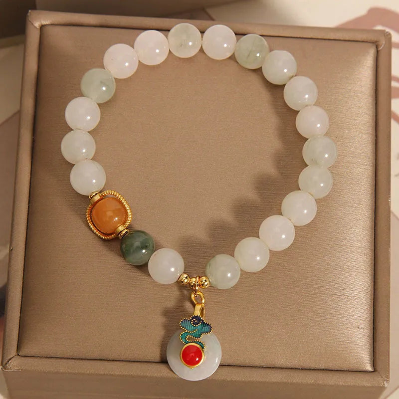 Women's jade crystal bracelet with ice jade colour, pearl accents, and peace jade buckle