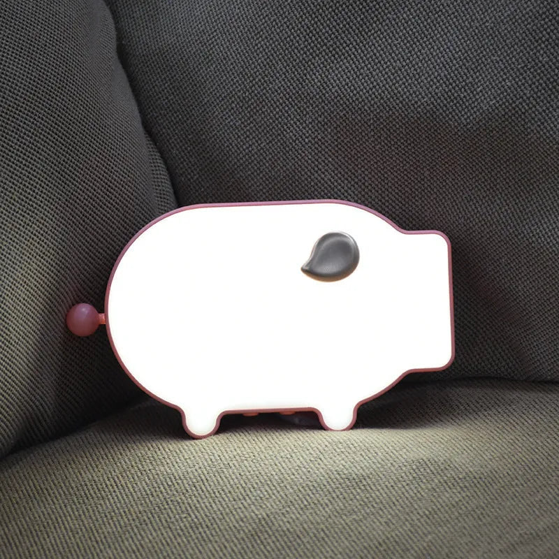 Blue and pink multifunctional LED alarm clock showing time and temperature with USB charging port