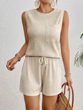 Women's apricot sleeveless round neck vest and matching shorts leisurewear set laid flat