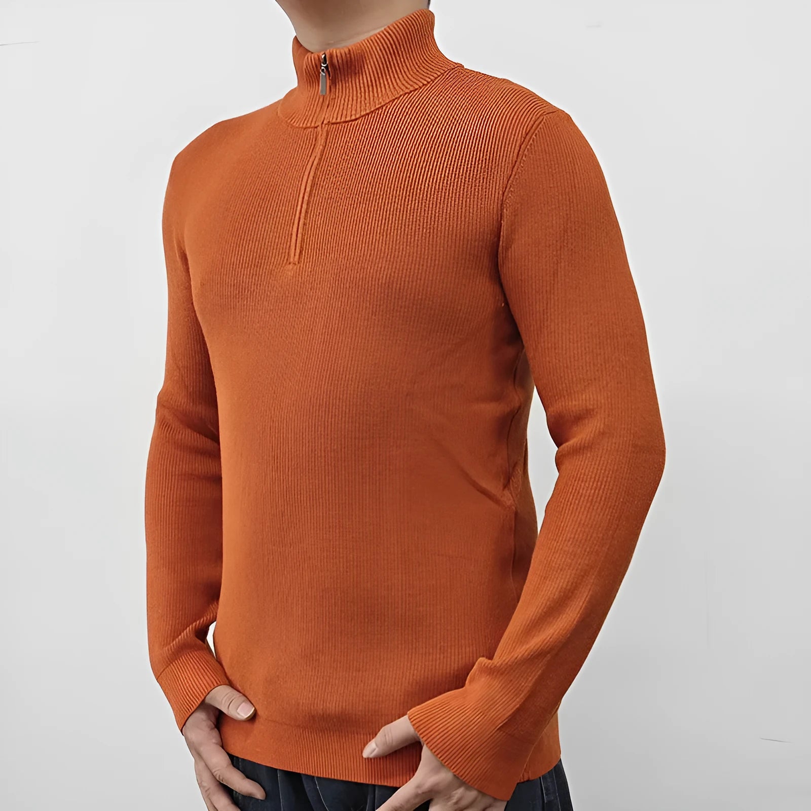 Man wearing a grey half turtleneck zipper sweater, a British style cotton blend pullover for spring.