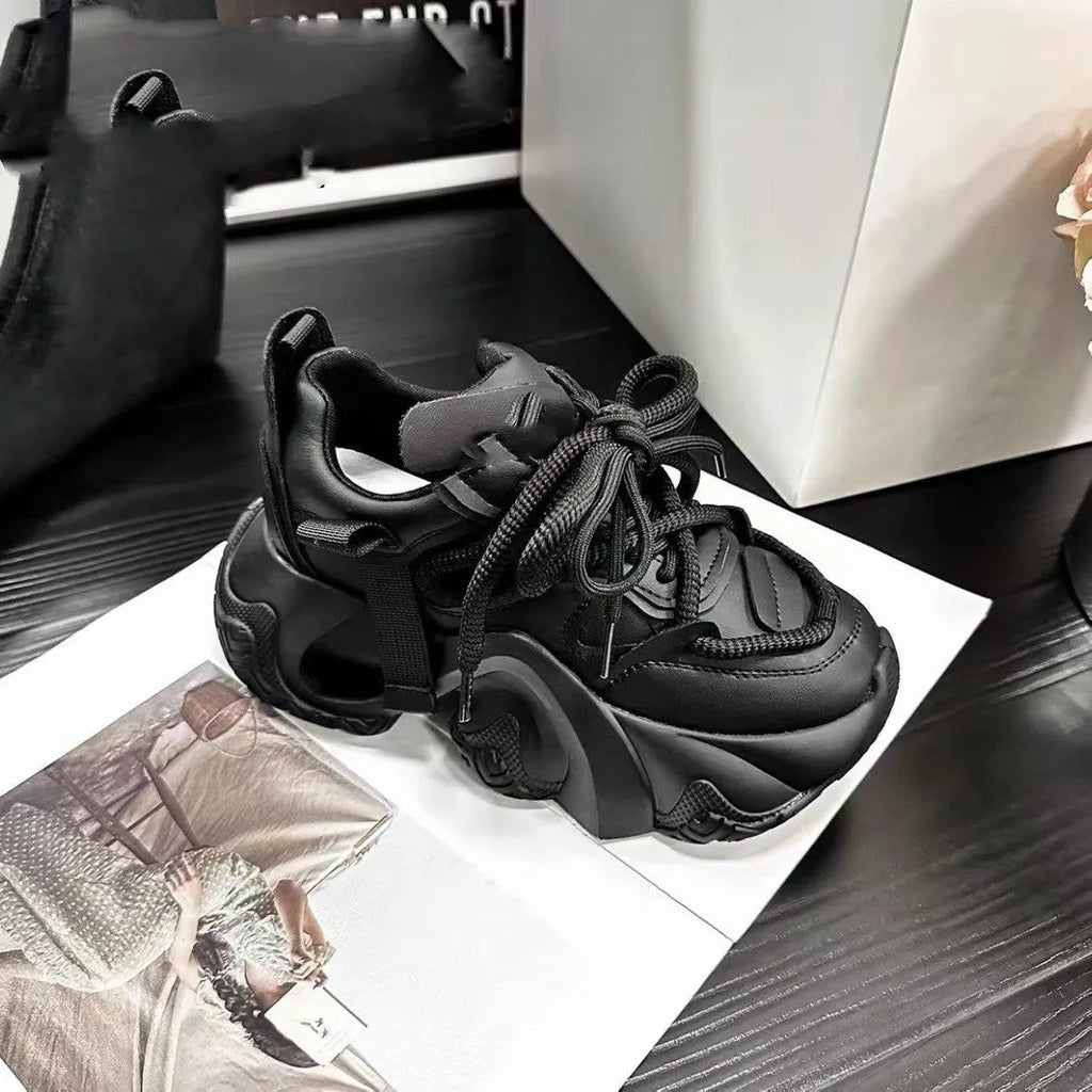 Women's low-top sneakers with wedge heel platform, cross-strap detail on synthetic leather upper, in creamy white colour.