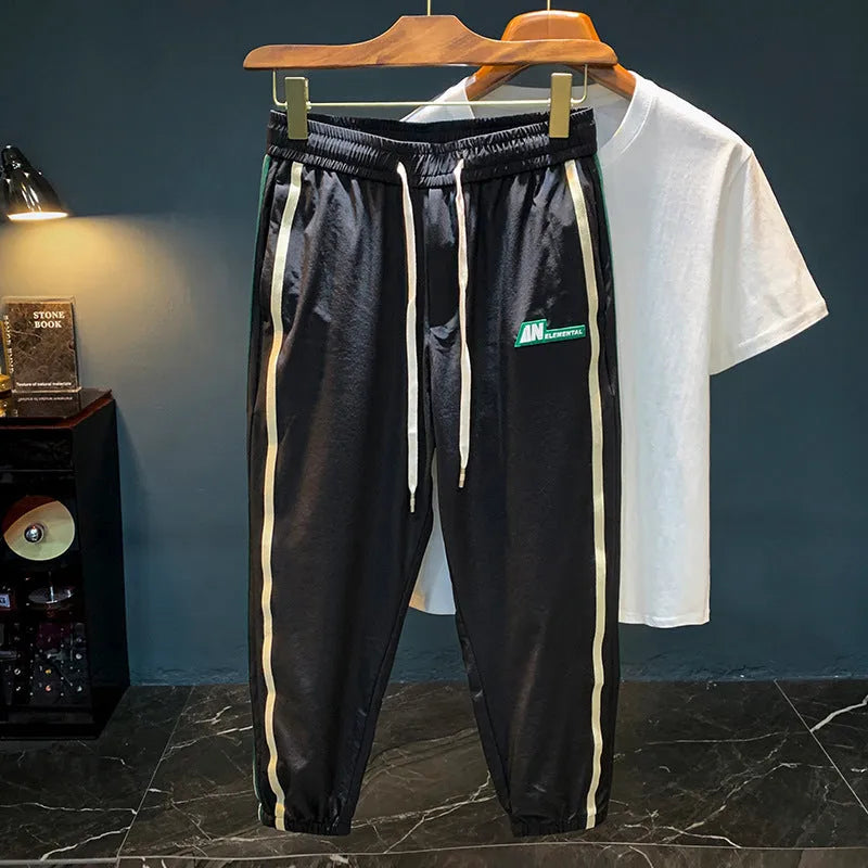 Men's black ice silk harem pants with mid waist and straight leg design