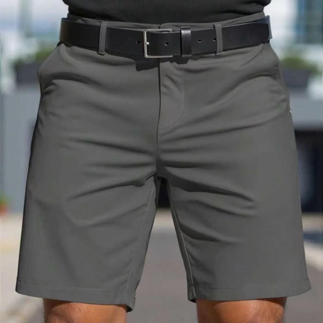 Men's straight cut solid colour shorts in light blue, showing fifth pants length and micro elastic polyester fabric.
