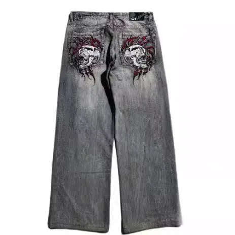 Grey washed-out wide-leg straight jeans on a mid-waist mannequin, showing zipper fly and relaxed fit.