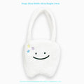 White plush shoulder tote bag with a large capacity and playful cute teeth design, shown with a crossbody strap.