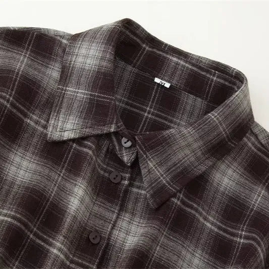 Women's loose-fit plaid shirt with long sleeves, button placket, and plant-and-flower print on a blue-green plaid base