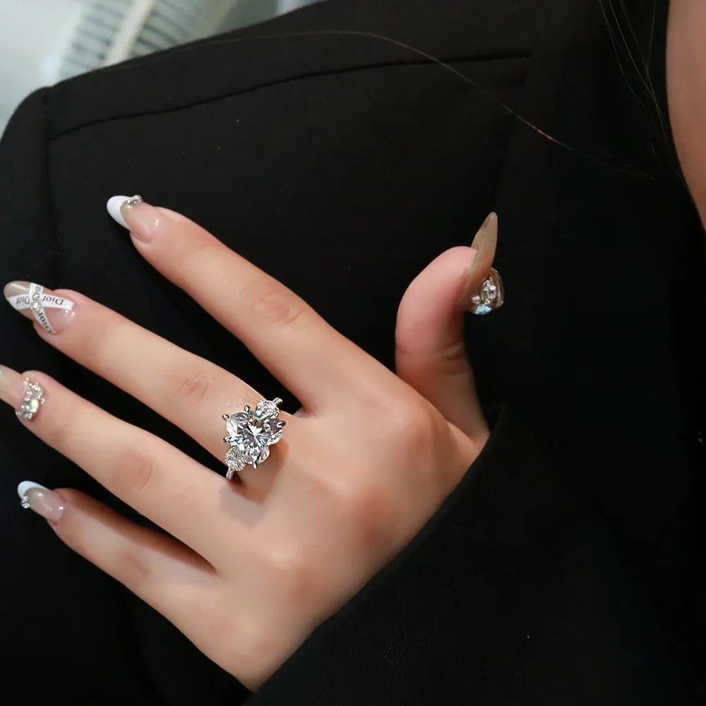 Heart-shaped diamond ring on white background, 925 silver band, open inlay setting