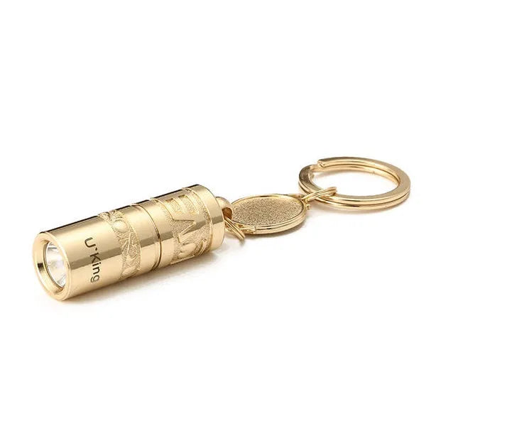 Gold zinc alloy waterproof mini LED flashlight on a keychain ring.