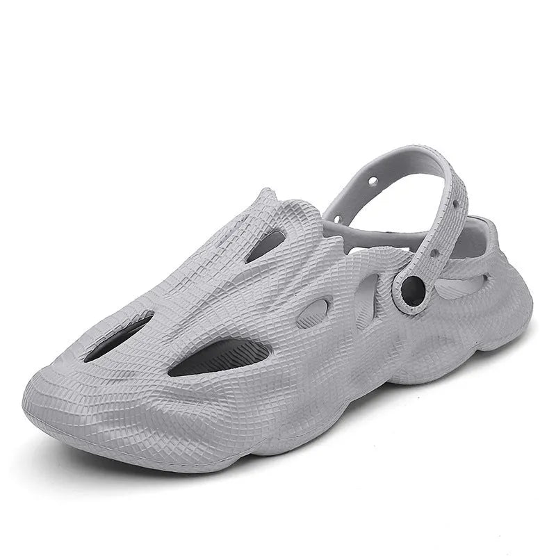 EVA soft men's summer beach shoes in grey colour on sandy surface