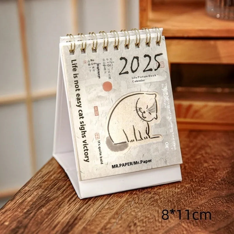 Mini 2025 desk calendar showing four design options including coffee time and motivational phrases