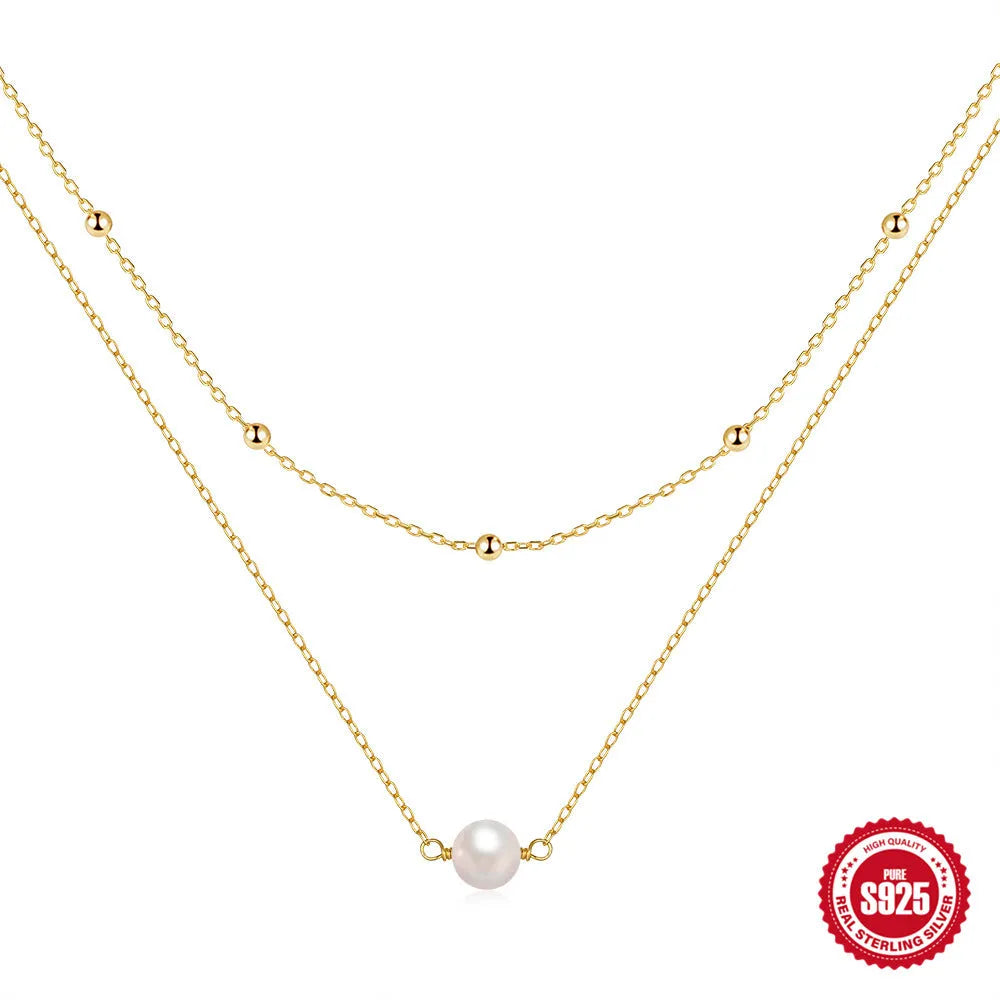 S925 sterling silver double layer necklace with twin geometric pearls in gold or white gold plating.