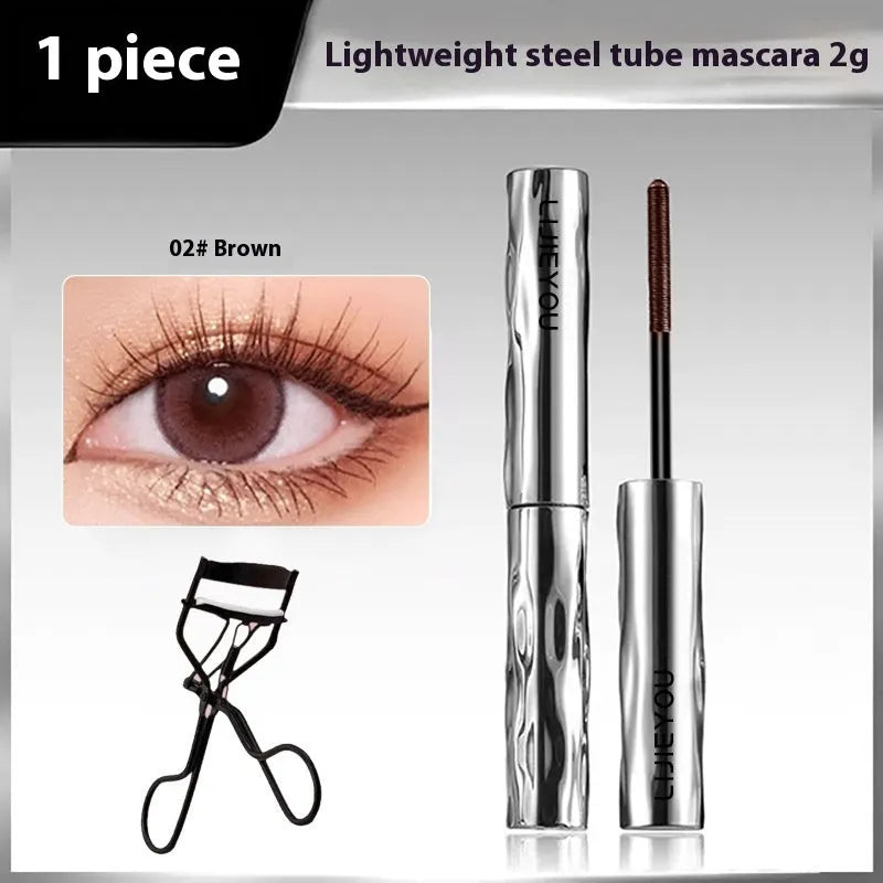Waterproof black and brown steel tube mascara with optional eyelash curler.
