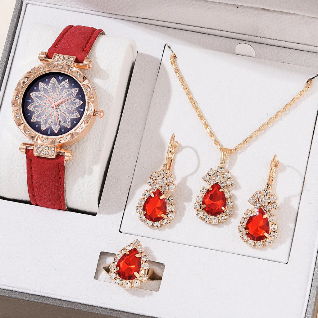 Women's quartz watch bracelet set with faux leather strap, circular dial, and matching jewellery in a colour suit