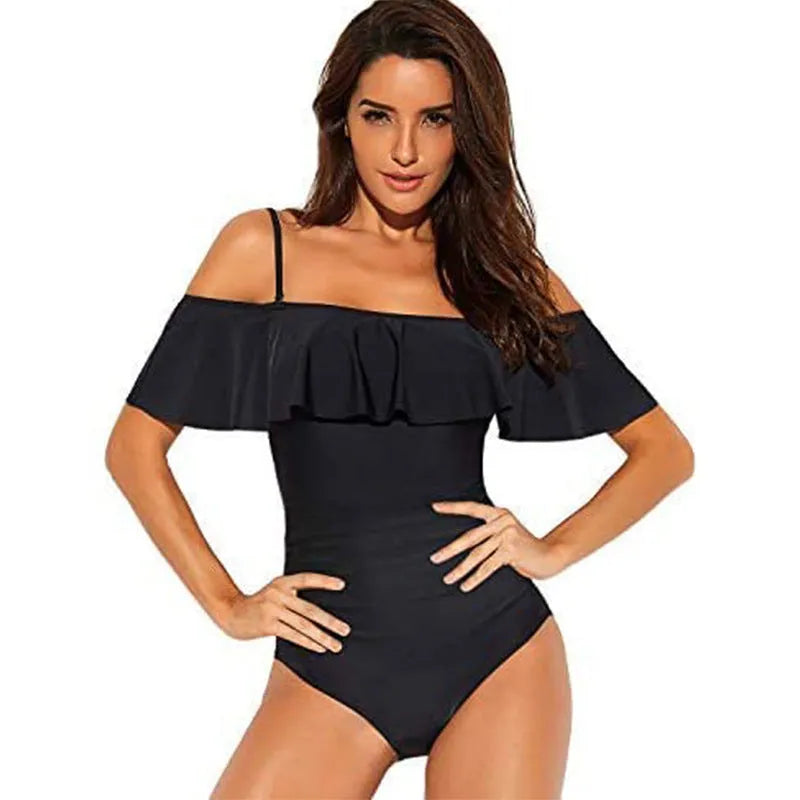 Black one-piece swimsuit with cut-out sections and ruffled strap detailing, tube top style