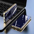 Mirror finish power bank with digital display showing battery percentage, available in black blue green grey red