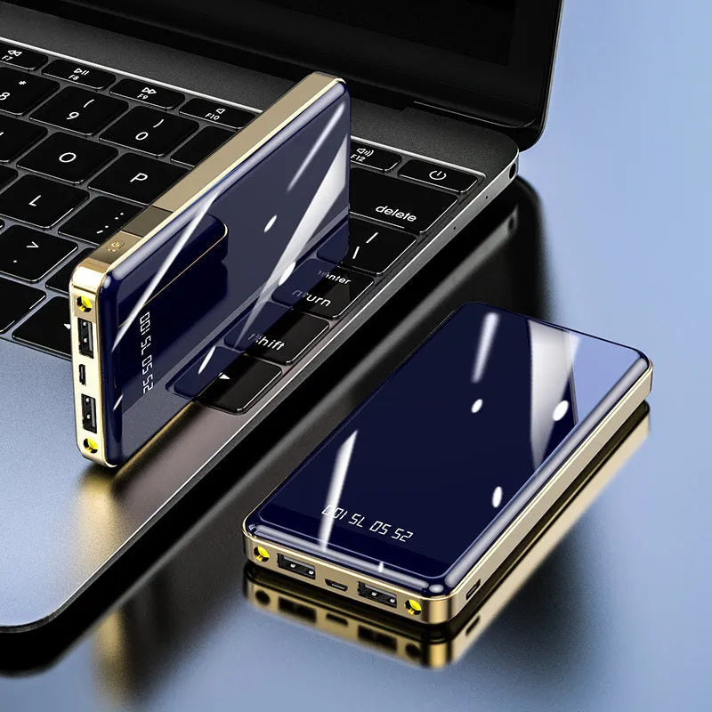 Mirror finish power bank with digital display showing battery percentage, available in black blue green grey red