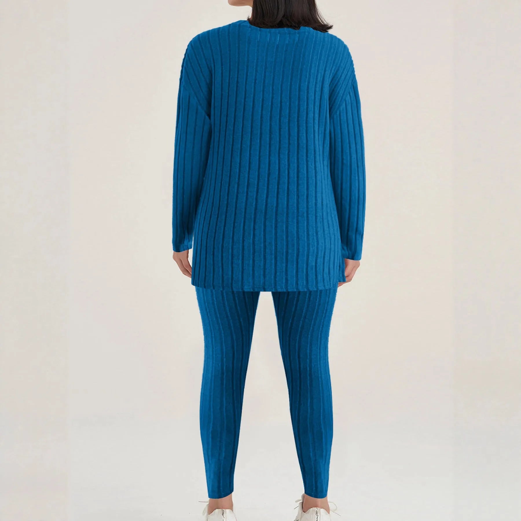 Black sunken stripe two-piece casual homewear set with top and pants on a hanger.