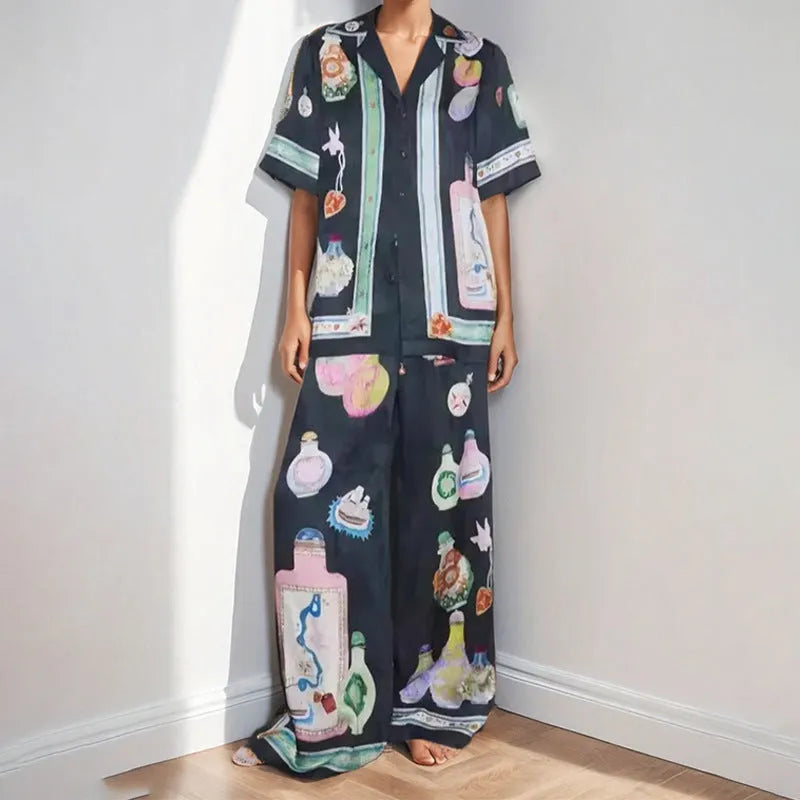 Black women's casual set with cartoon print, featuring a long-sleeve cardigan and trousers.