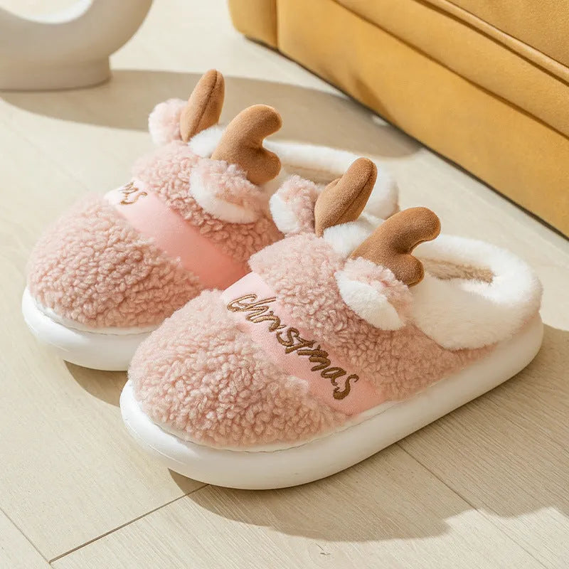 Christmas winter home slippers with suede upper and EVA sole in antler pink colour